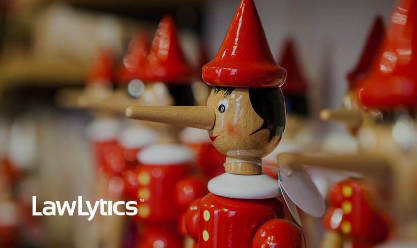 fake-reviews_Image-poster Several wooden Pinocchio dolls in red hats and button-up jumpers