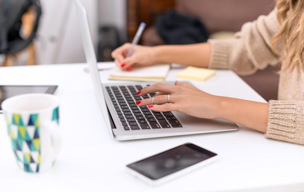 Woman,Typing,On,Laptop